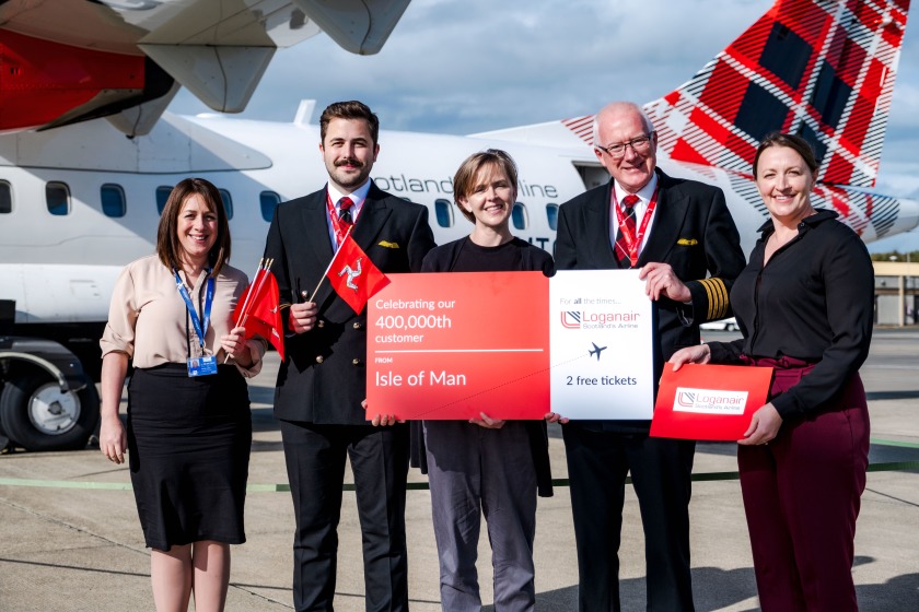 (L-R) Hannah Lo Bao (Commercial Director, IOM Airport), Robert Swanson (Loganair First Officer), Anré Walker (milestone passenger), Stephen Thursfield (Loganair Base Captain, IOM), Amy McLean (Loganair Communications Manager).