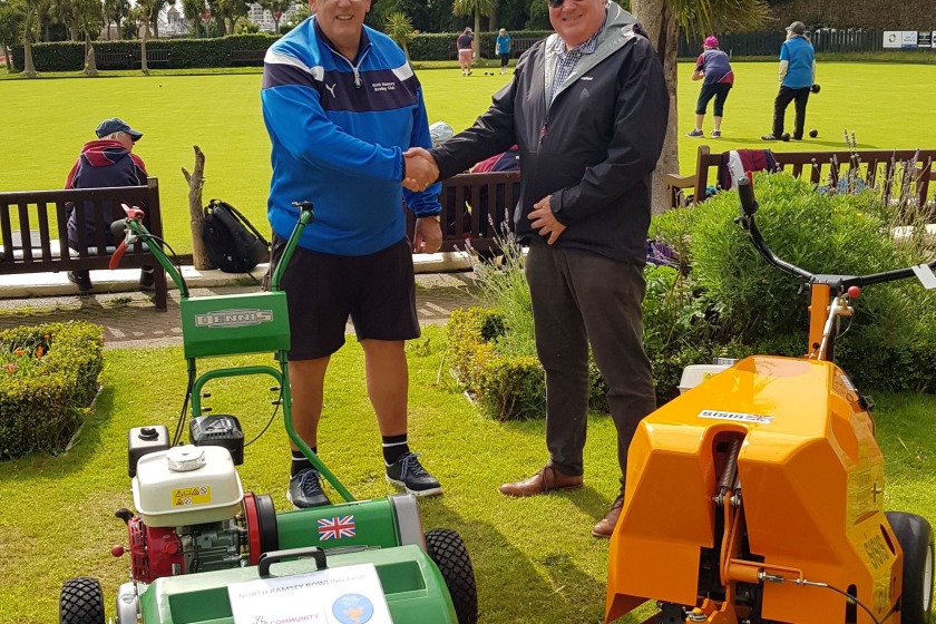 Treasurer Gary Lenton and Manx Lottery Trust Chairman Stephen Turner with the new machinery 